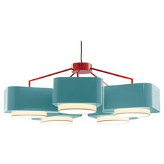 three lights hanging from a ceiling fixture with blue shades and red trims on the sides