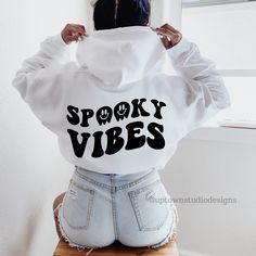 Spooky Vibes Hoodie Halloween Hoodie Fall Hoodie Oversized Hoodie Trendy Hoodie Halloween Sweatshirt Funny Halloween Gift Halloween Clothing This halloween hoodie and halloween crewneck sweatshirt is perfect for anyone that needs a cozy go to hoodie/sweatshirt to curl up in. So go for one that's soft, smooth, and stylish. It's the perfect choice for cooler evenings! ** ADD ON GHOST** This style comes with only a back design. If you want to add a ghost to the front, add this listing to your cart Halloween Hoodies, Halloween Clothing, Halloween Crewneck, Hoodie Oversize, Halloween Hoodie, Fall Hoodies, Fall Clothes, Spooky Vibes, Oversized Hoodie