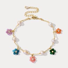 Experience the essence of summer with our Colorful Flowers Pearl Bracelet. Adorn yourself with these playful and elegant shimmering gemstones that exude grace and charm. Each delicate flower is uniquely crafted to add a touch of exquisite glamour Perfect for any outfit in any occasion. Every woman deserves have these lovely pieces. Let the gentle luster of pearls elevate your style! DETAILS Plating: 18K Gold Materials: 18K Gold on Brass, Natural stones, Pearl Measurements: Length: 6.49"(16.5cm)+ Summer Flower Charm Bracelet Jewelry, Multicolor Flower Decorated Jewelry For Spring, Spring Multicolor Floral Jewelry, Spring Multicolor Flower Decorated Jewelry, Spring Flower Jewelry With Colorful Beads, Everyday Wear Jewelry, Bracelet Summer, Fruit Jewelry, Clay Craft