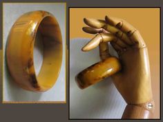 This attractive bangle bracelet in some sort of heavy plastic is meant to look like bakelite or catalin, but it does not test as one of those older plastics.  Very attractive, there is a flatter central band with top and bottom tapering in.  I like wear this kind of bracelet in a stack with silver and wooden bangles á la Nancy Cunard. Size: 7/8" top to bottom; 3" outer edge to outer edge; 2 1/2" inner diameter; @7 3/4" around inside. Marks: Unsigned Condition: Very good vintage condtion Inv # 23 Nancy Cunard, Wooden Bangles, Wooden Bangle, Resin Bangles, Art Resin, Enamel Brooch, Jewelry Women, Art Deco Style, Deco Style