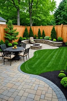 an outdoor patio with seating and landscaping in the back yard, surrounded by green grass