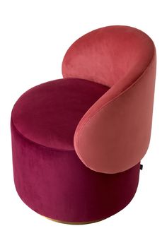 an upholstered chair with pink and red velvet