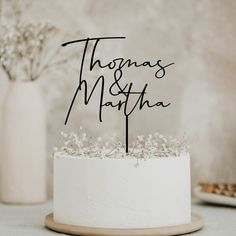 there is a wedding cake topper that says thomas and martha