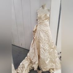 a dress is on display in front of a wall