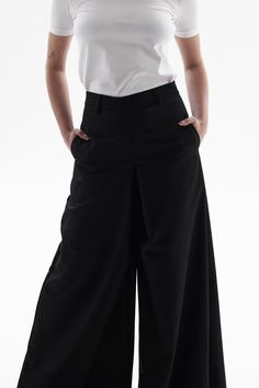 These pants are very versatile, perfect for both sneakers and heels. They are made from a dense poly-viscose fabric, with side seam pockets and a hidden zipper at the back. Relaxed Fit Elastane Wide Leg Pants For Work, Versatile Wide Leg Pants With Minimal Stretch, Versatile Wide-leg Elastane Pants, Wide Leg Work Pants With Minimal Stretch, Wide Leg Pants With Minimal Stretch For Work, Modern Stretch Wide-leg Pants, Stretch Wide-leg Pants With Welt Pockets, Casual Wide Leg Pants With Minimal Stretch, Modern Wide-leg Pants With Welt Pockets