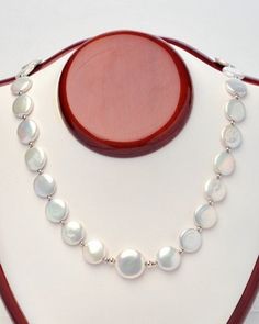 Outstanding, 12mm, white, coin pearl necklace, with a 16mm coin pearl center, surrounded by sterling silver beads.  Sterling silver clasp and a one inch extension chain 17 inches long. For yourself or give as a gift, to be enjoyed by all! Please visit our other Etsy shop: https://www.etsy.com/ca/shop/PearlEarringsEtc Coin Pearl Necklace, South Sea Pearl Necklace, Golden South Sea Pearls, Coin Pearls, South Sea Pearls, Akoya Pearls, One Inch, Freshwater Pearl Necklaces, Sterling Silver Bead