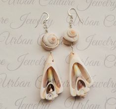 These bohemian style earrings feature large natural sea shells suspended from your choice of gold plated hypoallergenic stainless steel, silver stainless steel, sterling silver, 14k gold filled, 14k rose gold filled or 999 fine silver ear hooks. These earrings also come gift wrapped for free. Jewelry Theme: Ocean Mermaid Earrings Please look here for more sea shell jewelry https://www.etsy.com/shop/UrbanCoutureJewelry?ref=simple-shop-header-name&listing_id=765135936&search_query=sea+shel Bohemian Shell Earrings For Gift, Bohemian Shell-shaped Earrings For Gift, Unique Shell Earrings For Beach, Bohemian Shell Earrings For Jewelry Making, Bohemian Shell-shaped Earrings For Vacation, Bohemian Shell Jewelry For Pierced Ears, Unique Nickel-free Earrings For Beach, Bohemian Adjustable Dangle Shell, Bohemian Shell Earrings Nickel Free