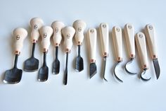 seven different types of kitchen utensils lined up next to each other