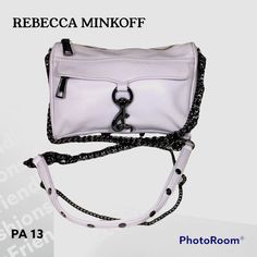 Rebecca Minkoff Mini Mac Crossbody Bag, Antique White Crossbody Bag. Equipped With All The Signature Hardware, The Rebecca Minkoff Mini Mac Crossbody Simplifies A Day On The Go With A Fuss-Free Strap And Easily Accessible Outside Pocket. Leather Exterior With Jacquard Fabric Lining. Zip Top Closure With Leather Pull. Exterior Zip Pocket With Dog Leash Clasp Closure And Leather Pull. Interior Slit Pocket. Bottom Rivet Detail. * Rebecca Minkoff Leather Crossbody With Black Metal Hardware. * Removable Chain And Leather Crossbody Strap; 21" Drop. * Zip Top With Long Leather Pulls. * Front Zip Pocket Covered By Lobster-Clasp Flap. * Inside, One Open Pocket; Fabric Lining. * Metal Stud Feet Rebecca Minkoff Mini Mac, White Crossbody Bag, Mini Mac, Rebecca Minkoff Bag, Signature Hardware, Rebecca Minkoff Mac, Leather Pulls, Jacquard Fabric, Antique White