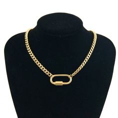 Make a statement and stand out in the crowd with the Atlas Necklace. This statement piece features a chunky curb chain, meticulously crafted from high-quality, water and tarnish-resistant stainless steel with a gleaming PVD gold plating. The secure carabiner clasp ensures a comfortable and confident wear. Rock it solo for a statement look or layer it with other necklaces for a personalized touch. Chunky Curb Chain PVD Gold Plated Stainless Steel Secure Carabiner Clasp Water & Tarnish Resistant 1 Metal Cuban Link Chain Necklace, Cuban Link Stainless Steel Necklace With Gold Chain, Metal Curb Chain Necklace, Chunky Chain Metal Cuban Link Necklace, Cuban Link Chunky Chain Metal Necklace, Chunky Cuban Link Metal Necklace, Cuban Link Necklace With Chunky Metal Chain, Everyday Oval Link Necklace With Carabiner Clasp, Metal Cuban Link Necklace With Adjustable Chain