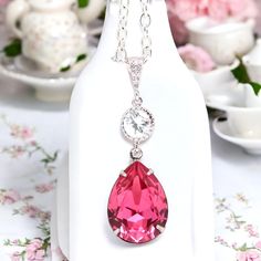 Elegant and romantic necklace made with: - gorgeous 18x13mm Rose teardrop pear shaped fancy stone, set in sterling silver plated setting - Hypoallergenic, Rhodium plated and tarnish resistant beautiful Cubic Zirconia embellished bail - sparkling .925 Sterling Silver connector with AAA Cubic Zirconia stone - the pendant drop is 1 1/2" long Finished with a sterling silver clasp and chain, the necklace is 16" and with a 2" extender chain the length can be adjusted to your choice.  MATCHING EARRINGS are available here: https://www.etsy.com/listing/224363580/pink-bridal-earring-fuchsia-earring https://www.etsy.com/listing/227859096/pink--crystal-earrings-bridal https://www.etsy.com/listing/231176642/pink-earrings-pink-bridesmaid-gift https://www.etsy.com/listing/227717919/pink-crystal-and-sterl Elegant Pink Drop Necklace For Gift, Elegant Teardrop Necklaces For Valentine's Day, Elegant Teardrop Necklace For Valentine's Day, Elegant Pink Teardrop Pendant Drop Necklace, Pink Teardrop Pendant Drop Necklace Gift, Elegant Pink Teardrop Drop Necklace, Crystal Teardrop Pendant Necklace Gift, Pear-shaped Crystal Drop Necklace Gift, Elegant Pink Pear-shaped Necklace