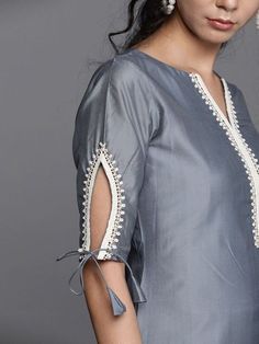 Buy dazzling grey cotton blend solid straight cut suit online at Inddus. This charming partywear straight cut suit comprises a cotton blend straight kurta with matching cotton blend bottom and net dupatta. Suit Neck Designs, New Kurti Designs, Kurta Patterns, Latest Model Blouse Designs, Designer Kurti Patterns