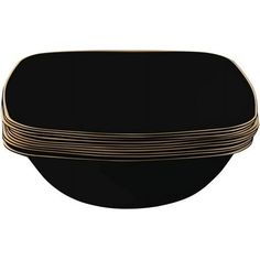 black and gold plates stacked on top of each other in the shape of a bowl