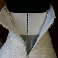 the back of a wedding dress on display