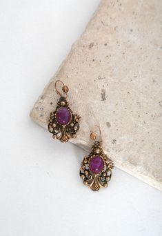 60s chandelier earrings | Vintage 1960s ornate gold tone purple drop earrings by CALIVINTAGEUSA on Etsy Ornate Purple Pierced Earrings, Vintage Chandelier Earrings With Intricate Design, Ornate Purple Drop Earrings, Ornate Purple Dangle Earrings, Vintage Purple Jewelry With Intricate Design, Vintage Purple Drop Earrings, Purple Vintage Jewelry With Intricate Design, Vintage Brass Filigree Chandelier Earrings, Vintage Purple Earrings