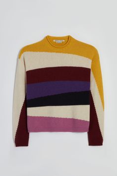 Meet Josephus. Our patchwork intarsia knit sweater. With its charming rugged crewneck with rolled detail, this lightweight knit is perfect for all seasons. Josephus's rich jewel tones bring a pop of warmth and sophistication to this roomy, cozy sweater. This long-sleeved, soft knit has an added link stitch detail at the cuffs and body trim. Josephus is made with 100% recycled fibers (GRS certified) with love, in ITALY. Unisex. Love In Italy, Rich Jewel Tones, Fashion Silhouette, Body Trim, Boutique Sales, Cycling Fashion, Recycled Yarn, Cozy Sweater, Jewel Tones