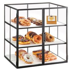 a display case filled with lots of different types of doughnuts and pastries