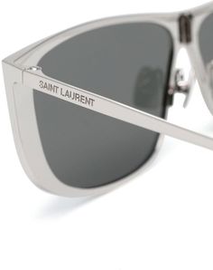 Elevate your style with these exquisite silver sunglasses from our LUNA collection. The sleek metal frame, adorned with the engraved logo, exudes luxury and sophistication, making a bold statement wherever you go. The grey spectacle lenses provide both protection and a touch of mystery, perfect for those who appreciate the finer things in life. Designed for the fashion-forward individual who appreciates the highest quality in designer fashion, these sunglasses are a must-have accessory for any l Luxury Wardrobe, Silver Sunglasses, Prada Designer, Engraved Logo, The Grey, Sunglasses Sale, City Streets, Spectacles, Womens Backpack