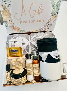 a gift box filled with personal care items and a sign that says, a gift just for you