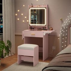 a pink vanity table with a mirror and stool