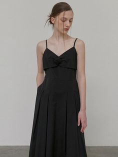 This product fuses elegance with simplicity, featuring a delicate corsage accent for a touch of romantic flair. The slender straps and sleek bodice cascade into a flowing skirt, creating a silhouette that's both timeless and modern. It's a versatile piece that can be dressed up for formal events or styled for a chic, casual look. - The dress boasts a flattering slip design, accentuated by a tasteful corsage detail for an added element of sophistication.- Its fluid skirt and fitted waist highlight the body's contours while providing comfort and ease of movement.- The fine straps and squared neckline present a display of minimalistic charm, suitable for various occasions.- Crafted with a blend of grace and practicality, this dress stands out with its understated beauty and functional el Formal Suspender Dress With Adjustable Spaghetti Straps, Elegant Suspender Dress With Adjustable Straps And Fitted Bodice, Elegant Suspender Dress With Adjustable Straps For Formal Occasions, Elegant Suspender Dress With Fitted Bodice For Evening, Elegant Evening Suspender Dress With Fitted Bodice, Elegant Evening Suspender Dress With Delicate Straps, Elegant Formal Suspender Dress With Adjustable Straps, Elegant Formal Dress With Adjustable Straps, Elegant Suspender Dress With Adjustable Straps