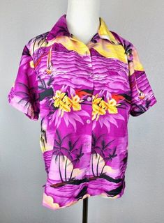 Classic 1970's Hawaiian top by King Kameha. Orchid purple with a vivid Hawaiian print in shades of yellow, orange and black. Print features scenes of Diamond Head, palm trees, blossoms, and sailboats. Made of a lightweight terivoile polyester. Buttons up the front. Great condition! Marked size Medium, but runs large for that size. Please check measurements for the best fit. MEASUREMENTS (fabric does not stretch) Chest: 40 inches Waist: 40 inches Length: 26 inches Yellow Hawaiian Shirt, Purple Hawaiian Shirt, Yellow Button-up Hawaiian Shirt For Beach, Hawaiian Top, Multicolor Cotton Hawaiian Button-up Shirt, Hawaiian Hibiscus Print Button-up Shirt, Multicolor Hawaiian Relaxed Fit T-shirt, Diamond Head, Orchid Purple