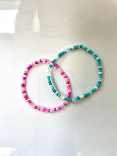 These bracelets are made out of stretchy string and seed beads. It's so cute and will match almost anything! All orders will recieve 2 stickers and a ring for free. Trendy Hand-strung Beach Jewelry, Trendy Hand-strung Jewelry For Beach, Multicolor Tiny Beads Bracelets For Beach Season, Multicolor Tiny Beads Bracelet For Beach Season, Tiny Beads Bracelets For Summer Beach, Tiny Beaded Bracelets For Summer Vacation, Summer Beach Bracelets With Tiny Beads, Summer Beaded Friendship Bracelets For Beach, Summer Beach Friendship Bracelets With Beads