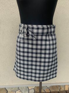 Vintage plaid skirt. The pleated mini skirt was made in the early 90's Black and white tartan skirt polyester fabric Excellent vintage condition SIZES: Eur 36 /US 6  Length: 17,5  inches (34 cm) Waist from seam to seam: 15 inches (37 cm) These pieces are in perfect, as good as a new vintage condition. Is it my size... ? The best way to check if a dress, tunic, or shirt will be a perfect fit for you is: 1. Take the same type of clothing from your wardrobe that is good for you. 2. Measure it on a flat table same as we do 3. Length 4. Width from armpit to armpit 5. Sleeve length etc. 6. Next compare those measurements that you made with measurements in the item description. Thanks to that kind of check you will be 100% sure that the clothing you purchase would be a perfect fit for you Brand: Preppy Plaid Tennis Skirt For Summer, Plaid Pleated Short Skort, Plaid Mini Tennis Skirt For Summer, Summer Plaid Mini Tennis Skirt, Plaid Pleated Skort, Plaid Pleated Skort For Summer, Summer Plaid Pleated Skort, Summer Pleated Plaid Skort, Preppy Plaid Mini-length Bottoms