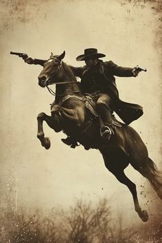 an old photo of a cowboy riding a horse with his lasso in the air