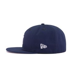 This looks like a regular Yankee fitted, or does it? Using Oceanside Blue, a fabric from New Era that is typically reserved for NFL teams, we created a “Navy” fitted that actually looks close to... Navy. As New Era’s MLB Navy is so dark that it’s often confused for Black, Oceanside Blue makes this fitted perfect for lighter shades of navy blue. For comparison, Oceanside Blue is the official team color for the New England Patriots. Grab this awesomely colored but simple custom designed fitted fro Yankee Hat, Yankee Fitted, Hat Stores, World Baseball Classic, San Diego Chargers, Classic Hats, Minnesota Timberwolves, New Era Cap, Oakland Athletics