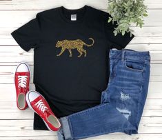 "* All shirts are unisex. * Product measurements may vary by up to 2 inches. * All Designs are originally made by myself or my team.  Cheetah shirt with the quote \"\" is a fun gift for men and women!  To see more designs of your topic Cheetah you can search & find them in the store:   https://www.etsy.com/shop/Retailorie  You find there also an announcement if the shipping & production times change :) cheetah shirt,cheetah gifts,wild animal shirt,african animal shirt,safari shirt,wildlife shirt,cheetah tshirt,cheetah t-shirt,cheetah tee shirt,cheetah t shirt," Casual Leopard Print Crew Neck T-shirt, Black Tiger Print Crew Neck Top, Black Crew Neck Top With Tiger Print, Leopard Print Relaxed Fit T-shirt With Crew Neck, Casual Leopard Print T-shirt With Letter Detail, Casual Leopard Print T-shirt With Relaxed Fit, Graphic Tee With Leopard Print And Crew Neck, Graphic Tee With Crew Neck In Leopard Print, Leopard Print Graphic Tee With Crew Neck