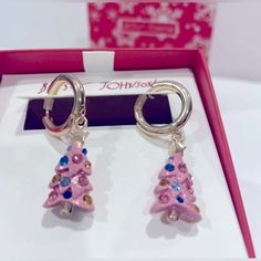 Brand New With Original Bj Tag In A Box Betsey Johnson Christmas Tree Dangle Drop Earrings Pink Color W Rhinestone Never Worn. Polished Gold Tone Huggie Hoop Earrings Feature A Pink Glitter Metallic Christmas Tree Charm, Gold Tone Star On Top Of Tree, Tree With Round Multicolored Crystal Accents For The Ornaments. Earrings Approximately 1.5” Inches Long. Super Cute!! Trendy Holiday Festive Accessory To Wear All Season. Xmas Christmas Festive Beautiful Gorgeous Adorable Shiny Cute Pretty Santa Wi Pink Earrings For Christmas Party, Betsey Johnson Christmas, Betsey Johnson Christmas Jewelry, Betsey Johnson Bracelet, Christmas Tree Charm, Betsey Johnson Necklace, Metal Christmas Tree, Christmas Tree Earrings, Betsey Johnson Jewelry