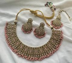 Elevate your style with our antique polki reverse AD necklace set. This handcrafted piece is a harmonious blend of traditional craftsmanship and contemporary design, making it the perfect accessory for formal occasions like weddings and parties. It comes in 3 different colors, rainbow, pink and green.  Material: Brass Ideal Gift: Whether you're treating yourself or looking for a special gift for a loved one, this antique polki reverse AD necklace set is sure to impress. Care Instructions: Clean with dry cotton. Keep in an airtight container when not in use. Avoid extreme heat and chemicals such as hairspray, perfume, deo, sunlight, etc. Ad Necklace Set, Polki Necklace Set, Necklace Set With Earrings, Green Rainbow, Polki Necklace, Choker Necklace Set, Green Material, Special Gift, Necklace Set