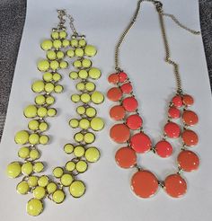 2 Wonderful vintage yellow and tangerine bib Acrylic necklaces! Gold tone great costume jewelry!! Both these necklaces are in wonderful condition and Both have great working clasps. The one I'm calling tangerine is not quite bright orange but still a nice bright color!! It measures 18" with gold tones. The yellow one is 18" with gold Tones. Two wonderful pieces!! Please see all photos for more details!! Acrylic Necklaces, Necklaces Gold, Vintage Yellow, Bright Color, Bright Orange, Pendant Necklaces, Costume Jewelry, Jewelry Necklace Pendant, Gold Tones