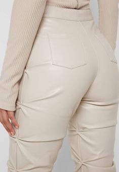 Back in stock! Elevate your wardrobe with our Trinity Faux Leather Pants. These ruched, faux leather pants exude a chic and exclusive vibe, while the fit and flare design flatters your figure. Add a touch of sophistication and luxury to any outfit with these must-have pants. Details: High waist, front zipper, fit and flare, ruched Size Chart: Small: Waist 26, Hip 33, Length 42Medium: Waist 27, Hip 35, Length 43Large: Waist 29, Hip 36, Length 43X-Large: Waist 30, Hip 38, Length 442X-Large: Waist 32, Hip 40, Length 44Model size small 5'8" 36-26-38 Made In: China Fabric Contents: Polyester Bungee Cord, Flare Trousers, Leather Trousers, Faux Leather Pants, Leather Leggings, Vegan Leather, Leather Pants, Pu Leather, High Waist