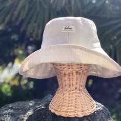 "A beige linen sun hat for beach days and summer fun. This sun hat for women has a nice wide brim to protect your whole face and even your neck and chest. This hat folds easily to bring along in your bag. This hat is made from a medium weight homespun linen and cotton blend fabric in a neutral beige color. Inside liner is white cotton. I used a stiff interfacing for brim to keep it's shape. Brim measures 4.5\" Crown depth is 3.5\". Contact me for custom fit option. SIZES AVAILABLE S - measures 2 Lightweight Wide Brim Sun Hat For Beach Season, Lightweight Wide Brim Sun Hat For Summer, Beige Lightweight Sun Hat For Outdoor, Lightweight Beige Outdoor Sun Hat, Vacation Linen Hat With Short Brim, Adjustable Natural Color Bucket Hat For Everyday, Lightweight Summer Bucket Hat For Vacation, Summer Linen Hat With Short Brim, Lightweight Beige Panama Hat For Outdoor