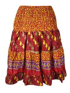 Take on the summer with the Boho Style Summer Ruched Elastic Skirt! Made from recycled silk saree fabric in a bold Red hue, this skirt features a flattering short length and eye-catching floral design. Perfect for beach adventures or summer events, let your daring side shine with this statement piece. The perfect mix of boldness and sustainability, our Boho Style Summer Ruched Elastic Skirt is made from recycled silk saree fabric, giving it a unique and eye-catching floral design. With a flatter Red Silk Summer Skirt, Traditional Mini Skirt For Summer, Flowy Skirt For Festive Summer Events, Traditional Silk Skirt For Summer, Festive Flared Skirt For Summer, Festive Tiered Skirt For Summer, Multicolor Festive Summer Skirt, Festive Multicolor Summer Skirt, Chic Travel Style