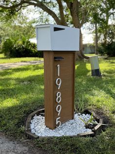 a mailbox sitting in the middle of a yard