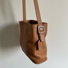 Vintage Coach Leather Bucket Bag Purse. Very Spacious & Well Loved Vintage Condition. Small Stains/Scratches/Imperfections Are Pictured. Leather Is Very Soft And High Quality. 2 Zipper Compartments And Magnetic Closure. Classic Coach Tag & Coach Branded Hardware. The Strap Has Adjustable Buckles. Roughly 10” L X 4” W X 9” H Classic Beige Square Bucket Bag, Classic Brown Bucket Shaped Bag, Rectangular Camel Bucket Bag, Chic Brown Bucket Bag With Snap Closure, Classic Bucket Shape Shoulder Bag, Classic Cognac Rectangular Bucket Bag, Brown Rectangular Bucket Bag With Snap Closure, Classic Bucket Bag With Snap Closure, Rectangular Brown Bucket Bag With Snap Closure