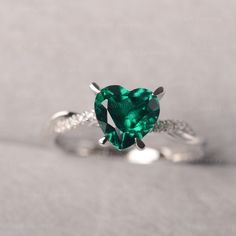 ◆ The ring is handcrafted from sterling silver and decorated with a dazzling 8*8 mm Lab Grown Emerald and CZs. It is suitable for engagement/anniversary/daily occasion. ◆ Production Description: Main stone Type: Lab Grown Emerald Main Stone Shape: Heart Cut Main Stone Size: 8*8 mm(1.59ct) Side stone: CZ Metal: 925 Sterling silver - Other options available in the drop down menu ◆ Customization: √Free for Add Engraving √Other Metal Type Available √Other Gemstones & Shapes Available √Personaliz Moissanite Heart Cut Diamond Ring For Proposal, Heart Cut Moissanite Diamond Ring For Proposal, Emerald Jewelry With Brilliant Cut For Proposal, Diamond White Heart Cut Ring With Halo Setting, Brilliant Cut Emerald Jewelry For Proposal, White Gold Emerald Promise Ring Fine Jewelry, Moissanite Heart Cut Ring With Halo Setting, Heart Cut Moissanite Ring With Halo Setting, Fine Jewelry Emerald Promise Ring With Center Stone