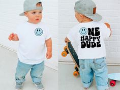 two photos of a toddler wearing a one happy dude t - shirt and holding a skateboard