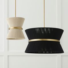 two black and white lamps hanging from the ceiling