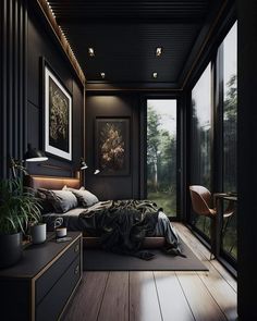 a bedroom with black walls and wooden floors