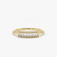 Made to Order.
Gold Kt: 14K (Please message me if you want 18K)
Custom Gold Color: Rose Gold, Yellow Gold, White Gold
Baguette Diamond: 3 pcs 2.5x1.5 MM
Total Number of Stones: 7
Total CTW: 0.35 Ctw
Diamond Color Clarity: G Color VS Clarity
Setting Type: Chanel Setting / With Milgrain
Band Width: 1.3 MM

Designed to grab attention, our luxurious baguette diamond ring will dress your hand in stunning sparkle. The handcrafted ring features a contemporary design with seven baguette diamonds in a st Channel Set Diamond Ring, Baguette Diamond Ring, Measure Ring Size, Baguette Diamond Rings, Baguette Ring, Channel Setting, Rose Gold Diamond Ring, Luxury Jewellery, Baguette Diamonds