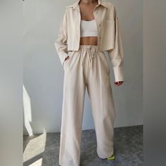 New Collared Drawstring Two Piece Pants Set. Apricot. Beige. 10% Polyester, 10% Cotton, 40% Linen, 40% Rayon Measured Flat Top: Length 17" Across Armpit 20" Across Shoulders 22" Sleeve 20" Bottom: Waist (Not Stretched) 11" Inseam 29" Front Rise 13" Back Rise 16" Please View Photographs. Oversized Pants Set, Cheap Cotton Women's Sets, Luxury Traditional Fit Self-design Set, Shirt Crop Top, Jeans Overall, Crop Top Long, Long Crop Top, Two Piece Pants Set, Jeans Cargo