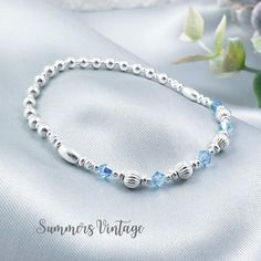 This elegant sterling silver bracelet featuring Aquamarine Swarovski crystals makes the ideal gift for those who celebrate their birthday in March  March is represented in the Swarovski birthstone chart as Aquamarine, a stunning light blue crystal that symbolizes health, hope, and youth  The eclectic mix of beautiful beads are strung on high quality, strong, professional jewellers' elastic meaning there are no fiddly clasps to deal with, simply roll the bracelet over your hand, and onto your wrist The bracelet is elegantly presented in a grey faux suede jewellery pouch, complete with aftercare instructions and a cleaning cloth, adding to its charm as an ideal gift ☽ SIZE: Available in wrist sizes: Small (17cm), Medium (18cm) or Large (19cm) If you're unsure about sizing please drop me a me Birthstone Chart, Birth Stones Chart, Suede Jewelry, Jewellery Pouch, Birthstone Bracelet, Ball Bracelet, Aquamarine Crystal, March Birthstone, Birthstone Bracelets