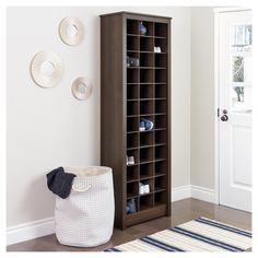 Set the tone for an organized space with the Prepac Wood Shoe Organizer. As an entryway shoe storage cabinet that lit up in a crisp white laminate finish 'zapatera', this shoe shelf towers 72.5"H x 23.5"W x 13"D, making for a tidy and aesthetic shoe rack for entryway use. Structured with a 'shoe drawer' approach, it takes the appearance of a seamlessly built hidden shoe rack. This shoe rack organizer is graced with 36 uniform cubbies that complement the standard shoe sizes. Adding to its capacit Shoe Storage In Mudroom, Rak Sepatu Diy, Cute Shoe Rack, Diy Shoe Racks, Shoe Storage White, Mud Room Ideas Entryway, Diy Shoe Rack Ideas, Laundry Room Tables, Shoe Rack Design