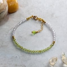 Peridot and Cubic Zirconia bracelet handcrafted using 3mm AAA faceted Peridot beads, 3mm AAA faceted Cubic Zirconia beads, 2mm gold  fill beads and fastened using a gold plated lobster claw clasp and 25mm extension chain for an adjustable fit. Peridot is one of the birthstones for August and would make a charming birthday gift. Peridot is the 16th anniversary gift on modern anniversary gift lists and this bracelet would make the perfect gift as a token of love. Peridot is known as the stone of c Faceted Beads Bracelets As May Birthstone Gift, Faceted Beads Bracelet For May Birthstone Gift, May Birthstone Bracelets With Faceted Beads As Gift, Faceted Rondelle Crystal Bracelet Gift, Adjustable Peridot Bracelets For Gifts, Peridot Faceted Beads Jewelry Gift, 16th Anniversary Gifts, Growing Crystals, 16th Anniversary