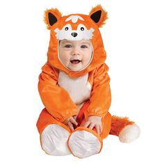 a baby dressed in an orange fox costume