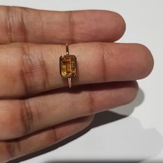 14k solid rose gold natural AAA quality emerald cut rectangular shaped citrine semi precious gemstone ring. 1. The weight of the natural citrine gemstone used in the ring =1.10 cts. 2. The weight of 14k solid rose gold used in the ring =1.130 grms. 3. The design of the ring is very nice and beautiful. 4. I have used all my skills and experience to manufacture this ring as beautiful as I can and I do hope my work will be appreciated. Thanks Rectangular Prong Set Topaz Ring Fine Jewelry, Modern Gold Topaz Ring In Rectangular Shape, Rectangular Citrine Gemstone Ring, Modern Gold Rectangular Topaz Ring, Gold Square Cut Emerald Ring With Gemstone, Emerald Cut Citrine Gemstone Jewelry, Yellow Gold Topaz Ring With Rectangular Stone For Gift, Rectangular Topaz Ring In Yellow Gold, Yellow Gold Topaz Ring With Rectangular Stone